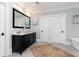 Stylish main bathroom featuring a double vanity, soaking tub, and ceramic tile flooring at 610 Valley Green Trce, Marietta, GA 30068