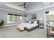 Main bedroom with tray ceiling, large windows, sitting area, and neutral color scheme at 610 Valley Green Trce, Marietta, GA 30068