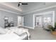 Bright main bedroom with sitting area and open doorway leading to an ensuite bathroom at 610 Valley Green Trce, Marietta, GA 30068