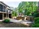 Elevated view of pool and outdoor entertaining area, with a covered patio and landscaped surroundings at 610 Valley Green Trce, Marietta, GA 30068