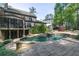 An eye-level view of a refreshing backyard pool and spa area with waterfall feature and landscaping at 610 Valley Green Trce, Marietta, GA 30068