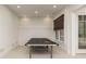 Bright recreation room features a ping pong table, coffered ceilings, and recessed lighting at 610 Valley Green Trce, Marietta, GA 30068