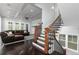 Bright living space with staircase and open design, featuring hardwood floors and natural light at 610 Valley Green Trce, Marietta, GA 30068
