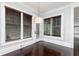 Sun room features wooden floors, three large windows with shades, and a decorative light fixture at 610 Valley Green Trce, Marietta, GA 30068
