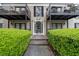 View of building entrance, showcasing well-maintained landscaping and access at 3440 Essex Ave # 103, Atlanta, GA 30339