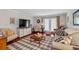 Bright living room with hardwood floors, a flat screen, and lots of seating at 3440 Essex Ave # 103, Atlanta, GA 30339