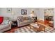 Open living area with hardwood floors and traditional decor at 3440 Essex Ave # 103, Atlanta, GA 30339
