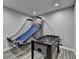Finished basement with recreational games like foosball and a basketball arcade at 443 Lakeshore Dr, Berkeley Lake, GA 30096