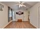 Bright bedroom with hardwood floors and ceiling fan at 443 Lakeshore Dr, Berkeley Lake, GA 30096