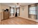 Bedroom with hardwood floors, windows, and dresser at 443 Lakeshore Dr, Berkeley Lake, GA 30096