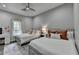 Bedroom featuring two twin beds, a vanity, and hardwood floors at 443 Lakeshore Dr, Berkeley Lake, GA 30096