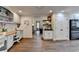 Open concept home office featuring wood floors, built-in desks, and ample storage at 443 Lakeshore Dr, Berkeley Lake, GA 30096