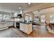 This bright kitchen has stainless steel appliances, white cabinets and countertops at 443 Lakeshore Dr, Berkeley Lake, GA 30096