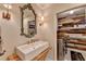 Laundry room with accent wall, patterned floor, modern washer and farmhouse-style sink at 443 Lakeshore Dr, Berkeley Lake, GA 30096