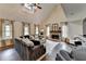 Bright living room with vaulted ceiling, fireplace, and comfortable seating at 443 Lakeshore Dr, Berkeley Lake, GA 30096