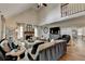 Bright living room featuring a vaulted ceiling, wood floors, and fireplace with stone surround at 443 Lakeshore Dr, Berkeley Lake, GA 30096