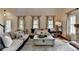 Inviting living room with hardwood floors, stylish furnishings, and natural light at 443 Lakeshore Dr, Berkeley Lake, GA 30096