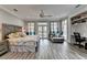Spacious main bedroom with a desk, seating area, and bed frame at 443 Lakeshore Dr, Berkeley Lake, GA 30096