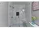 Modern shower with glass door, white subway tile, and built-in seat at 443 Lakeshore Dr, Berkeley Lake, GA 30096