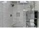 Walk-in shower with white subway tile and black and white patterned tile floor at 443 Lakeshore Dr, Berkeley Lake, GA 30096