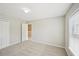 Cozy bedroom with plush carpet, neutral paint, and access to another room at 172 Mill Creek Dr, Canton, GA 30115