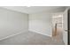 A bright bedroom with carpet and entrance to other room at 172 Mill Creek Dr, Canton, GA 30115