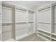 Walk-in closet with custom built-in shelving and storage solutions at 172 Mill Creek Dr, Canton, GA 30115