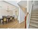 Elegant entryway with staircase, hardwood floors, and dining room access at 172 Mill Creek Dr, Canton, GA 30115