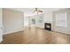 Inviting living room boasts a cozy fireplace, ceiling fan, and natural light at 172 Mill Creek Dr, Canton, GA 30115