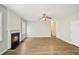 Comfortable living room with a fireplace, modern ceiling fan, and neutral paint at 172 Mill Creek Dr, Canton, GA 30115