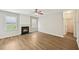 Bright living room with a fireplace, hardwood floors, and views of the backyard at 172 Mill Creek Dr, Canton, GA 30115