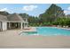 A luxurious community swimming pool with ample lounge seating and a covered poolside retreat at 172 Mill Creek Dr, Canton, GA 30115