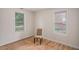 This bedroom offers natural light from two windows and hardwood flooring at 2447 Crestview Ave, Decatur, GA 30032