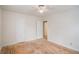 A bedroom with hardwood floors, two closets, and a ceiling fan with white walls at 2447 Crestview Ave, Decatur, GA 30032