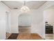 Dining room featuring an archway, hardwood floors, and charming light fixture at 2447 Crestview Ave, Decatur, GA 30032