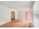 Bright living room with original hardwood floors, awaiting your personal touch at 2447 Crestview Ave, Decatur, GA 30032