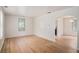Bright living room with original hardwood floors, awaiting your personal touch at 2447 Crestview Ave, Decatur, GA 30032