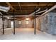 Unfinished basement with concrete floors, exposed ceiling, and cinder block walls at 295 Glen Lake Dr, Atlanta, GA 30327