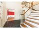 Foyer with hardwood staircase, tile flooring, and view into a living space at 295 Glen Lake Dr, Atlanta, GA 30327