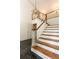 Foyer with hardwood staircase, chandelier, and paneled doors at 295 Glen Lake Dr, Atlanta, GA 30327