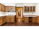 Kitchen with wood cabinets, white countertops, and built-in workstation at 295 Glen Lake Dr, Atlanta, GA 30327