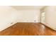 Room with hardwood floors, white walls, and natural light from large windows at 295 Glen Lake Dr, Atlanta, GA 30327