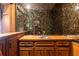 Classic wet bar area featuring hardwood cabinets, countertop, and decorative backsplash at 295 Glen Lake Dr, Atlanta, GA 30327