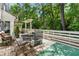 Relax on the back deck surrounded by a lush forest, a perfect backyard escape at 411 Woodstone West Dr, Marietta, GA 30068