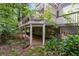 Beneath the back deck is a brick patio and support pillars at 411 Woodstone West Dr, Marietta, GA 30068