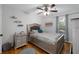Bedroom featuring a full-size bed, hardwood floors, nightstand and natural light at 411 Woodstone West Dr, Marietta, GA 30068