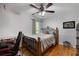 Comfortable bedroom featuring a full-size bed, hardwood floors, and natural light at 411 Woodstone West Dr, Marietta, GA 30068