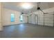 Spacious garage with three separate doors and windows, providing ample space for vehicles and storage at 411 Woodstone West Dr, Marietta, GA 30068