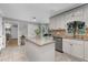 Kitchen featuring white cabinets, stainless steel appliances, and tile backsplash at 411 Woodstone West Dr, Marietta, GA 30068