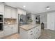 Spacious kitchen with white cabinets, stainless steel appliances, and granite countertops at 411 Woodstone West Dr, Marietta, GA 30068